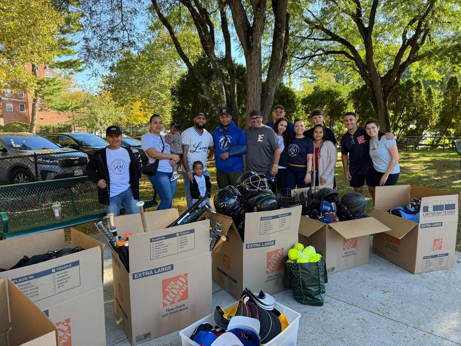 Supporters standing together during the sports equipment drive