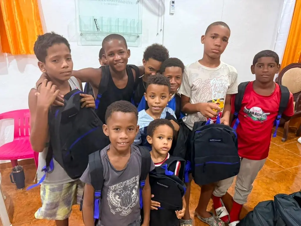 A group of boys with their new school backpacks