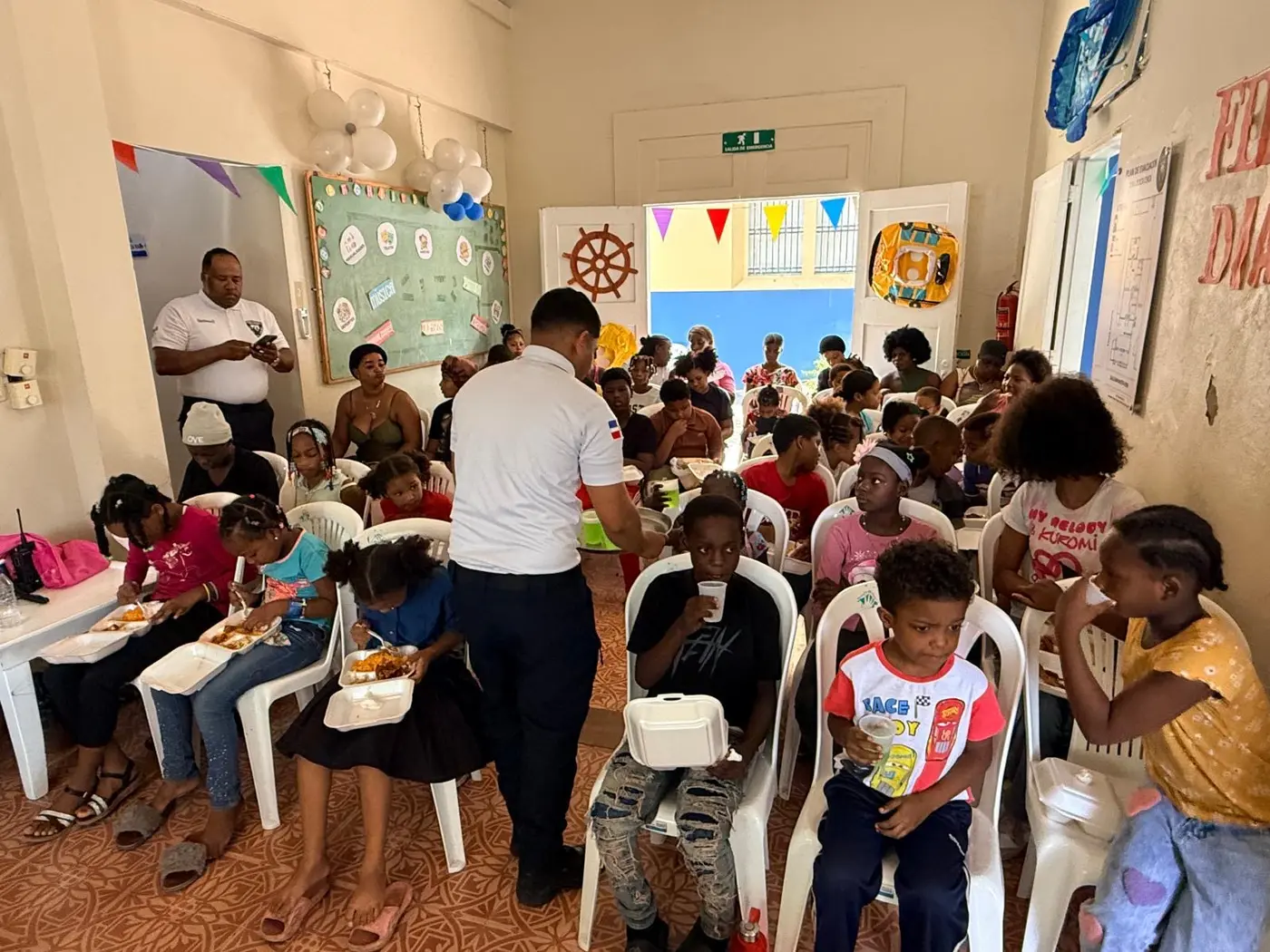 Children and families sharing a community meal
