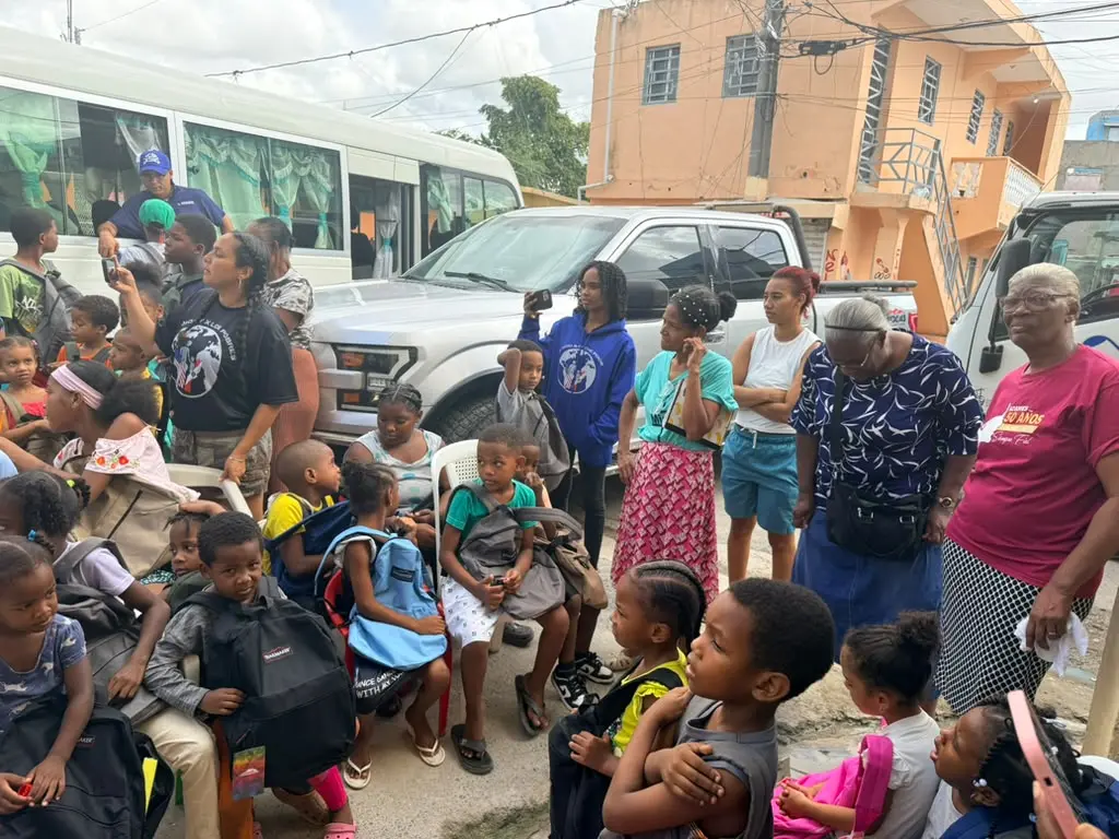 Children and community partners together at the backpack drive